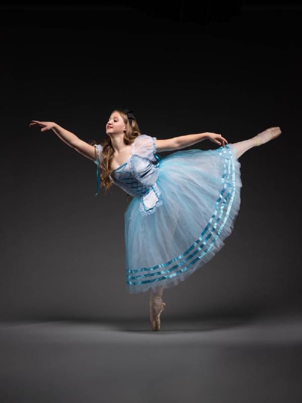 Classical ballet dancer in elegant pose during performance