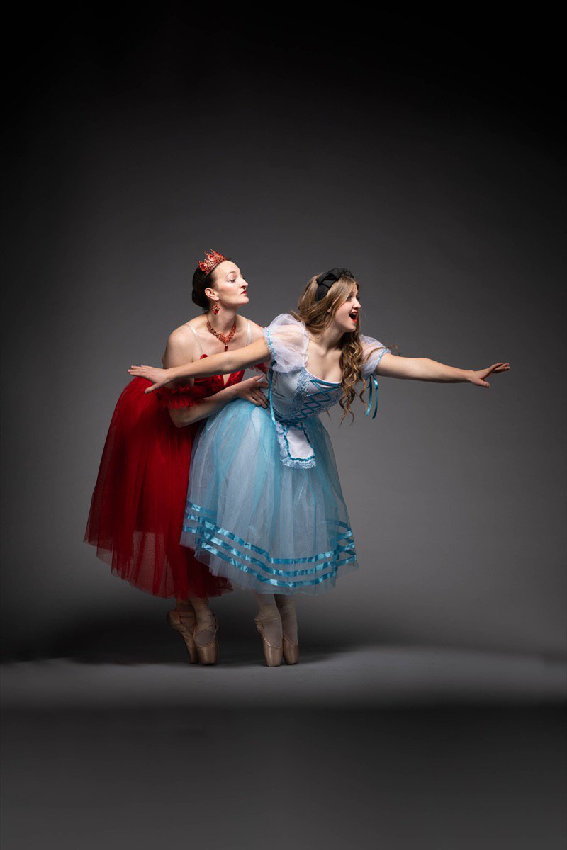 Ballet performer in elaborate wonderland costume on stage